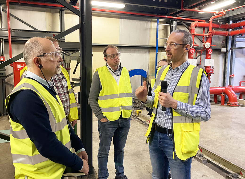 Matteo Ponchione (on the right), Quality Manager at Avery Dennison, explains the processes in production.