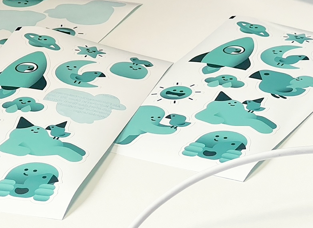 Sticker sheet with various motifs in contour die-cut shapes.