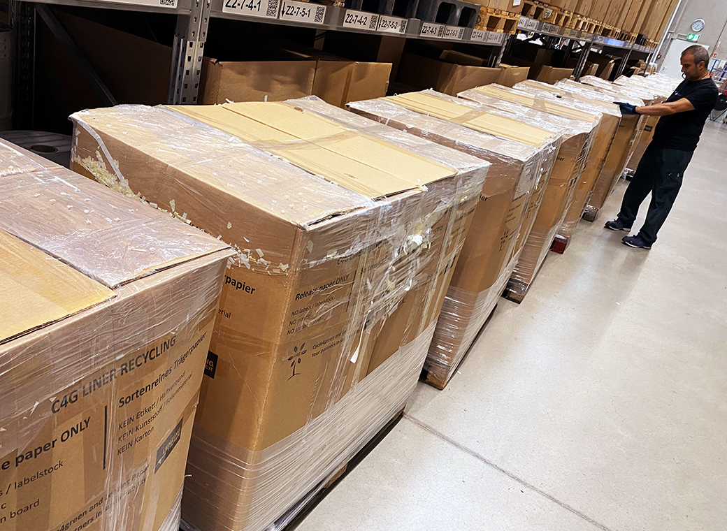 60 tightly packed bundles of release liner waste, stacked on 30 pallets, with a total weight of 12 tons, are ready to be collected and recycled into new products.